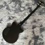 Custom irregular shape body electric guitar in black color