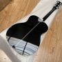 Custom solid wood acoustic guitar fishbone binding in gloss black finish